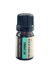 Essential oil bottle labeled 'Hot Springs' by Mountain Time on a white background