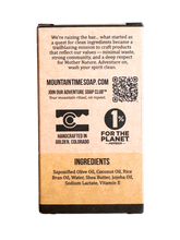 Back of a soap packaging with branding and QR code on a white background