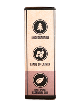 Product packaging with biodegradable, loads of lather, and pure essential oils text on a white background